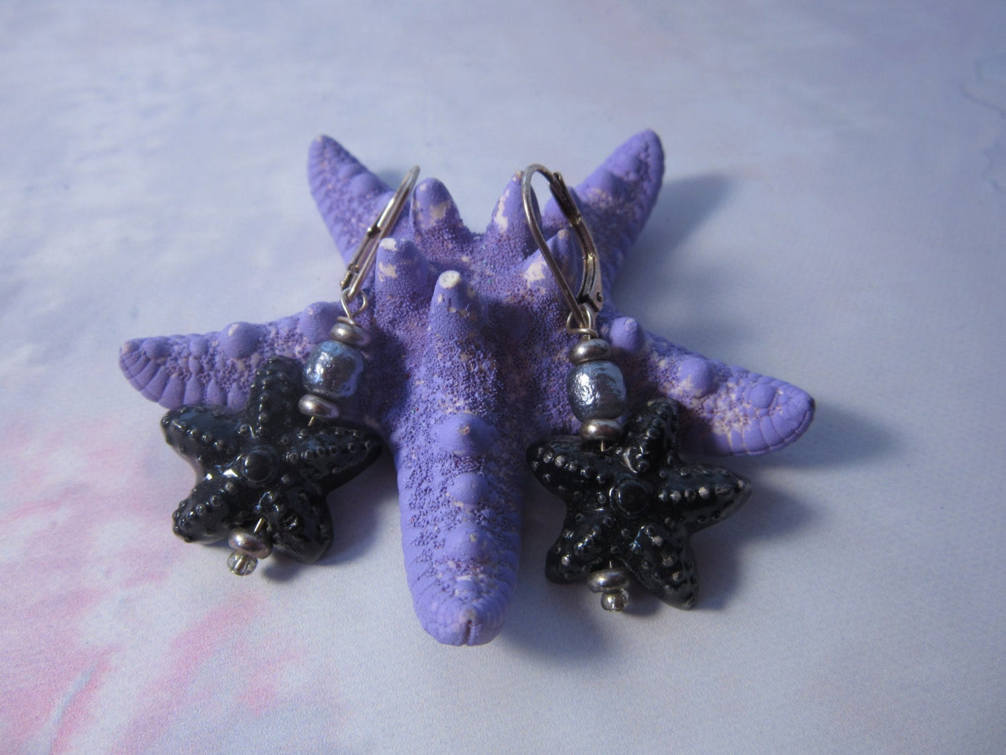 STARFISH SEA EARRING worn by a model, highlighting its boho style and versatility for various outfits.