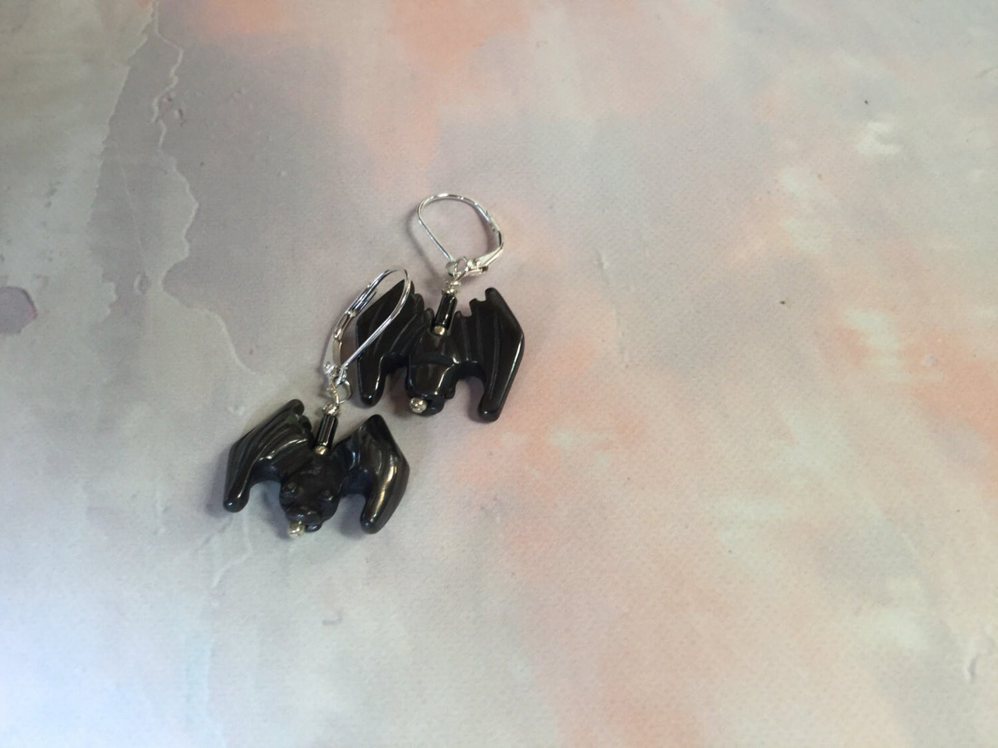 Bat Earrings of black stone - Halloween Jewelry, displayed as a playful and whimsical gift for animal lovers, highlighting the bat motif.
