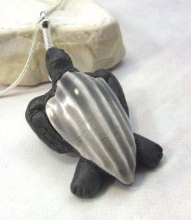 LEATHERBACK TURTLE PENDANT on a sterling silver chain showcasing the handcrafted details of this sea turtle jewelry, perfect for adding a unique touch to any outfit.