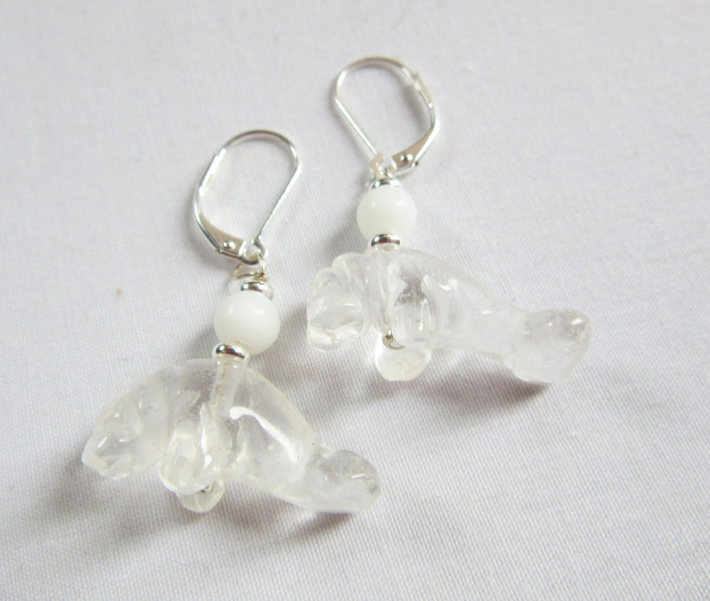 Beautifully crafted Manatee Earrings with Clear Quartz Drop, a must-have accessory for Florida wildlife enthusiasts.
