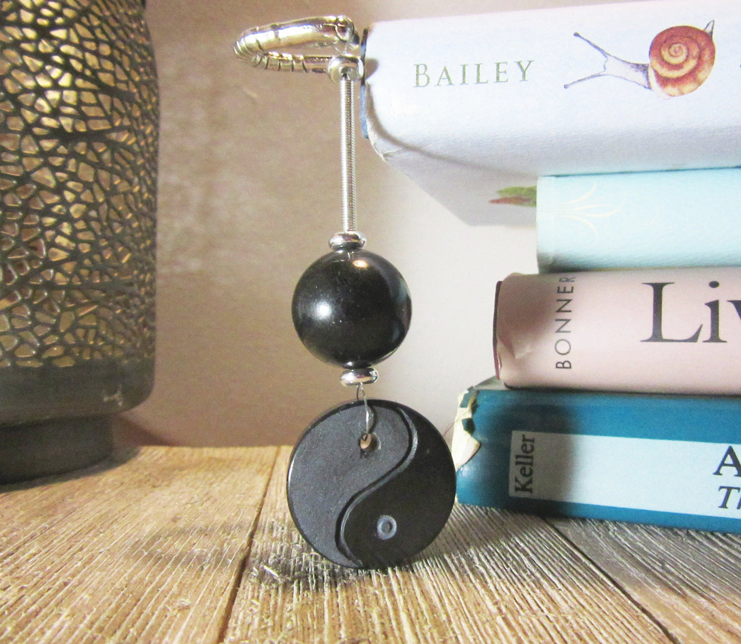 Close-up view of Yin Yang Bookmark, Zen gift for her and an elegant accent for a zen garden or bookshelf.
