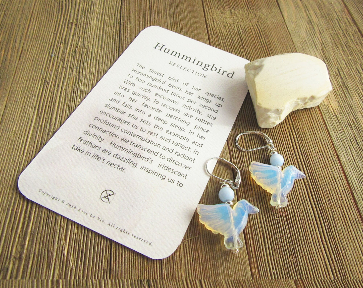 Artisan-crafted opalite bird lover earrings, representing hope and jubilation.
