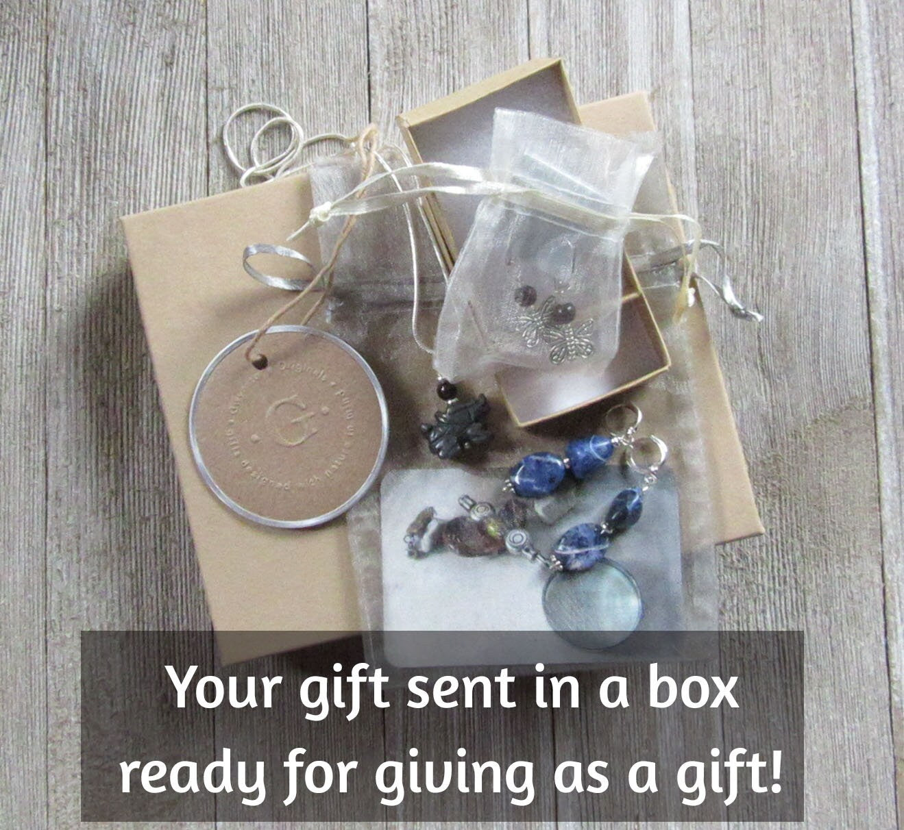 Cute Manatee Earrings made from blue sodalite, designed as a unique gift for animal lovers, secured with lever back fasteners.