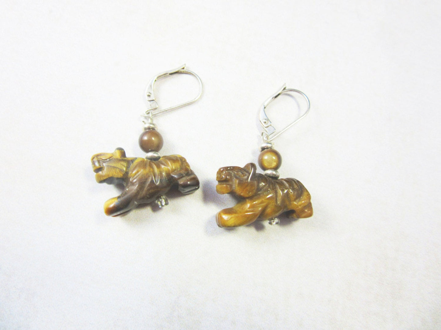 Tiger Eye Stone Earrings on display, handcrafted with intricate details, ideal power animal gift for tiger enthusiasts.