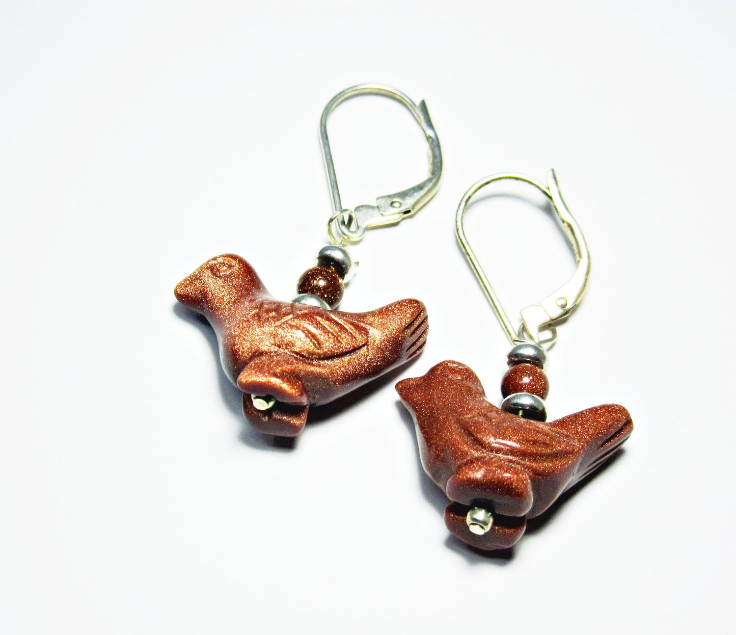 Songbird Earrings featuring carved stone animal designs of a duck and bluebird, perfect bird watcher gift for spring and summer accessory.