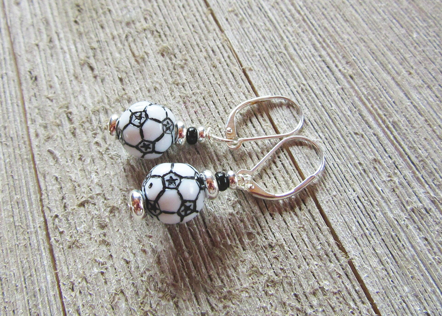Close-up of Soccer Ball Earrings featuring a back lever design - Sports Theme Jewelry - Novelty Women Accessories from Enlivenadorn by Gwynstone.