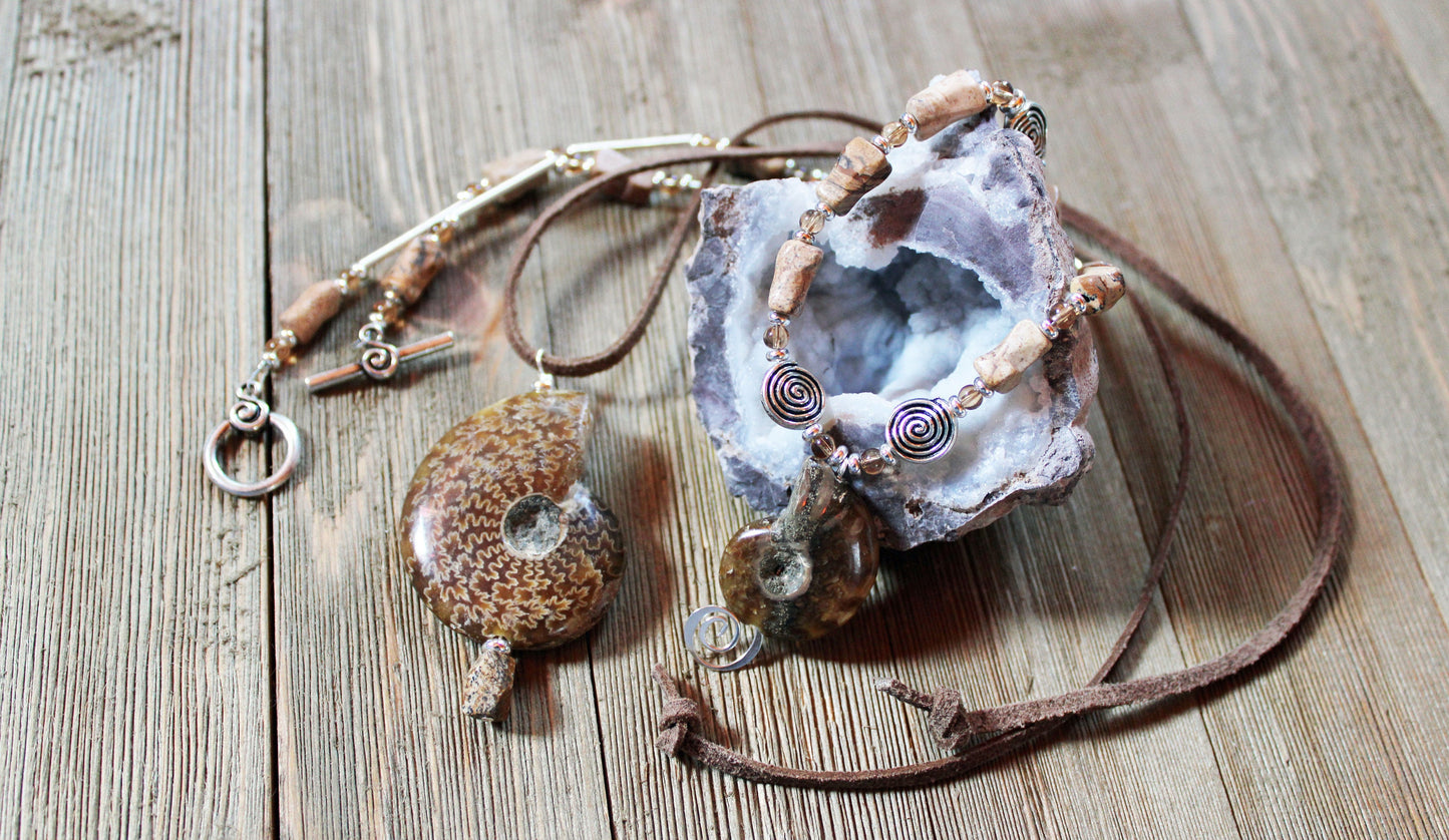 Handcrafted soulmate necklace set with unique ammonite fossil stones and leather cord.