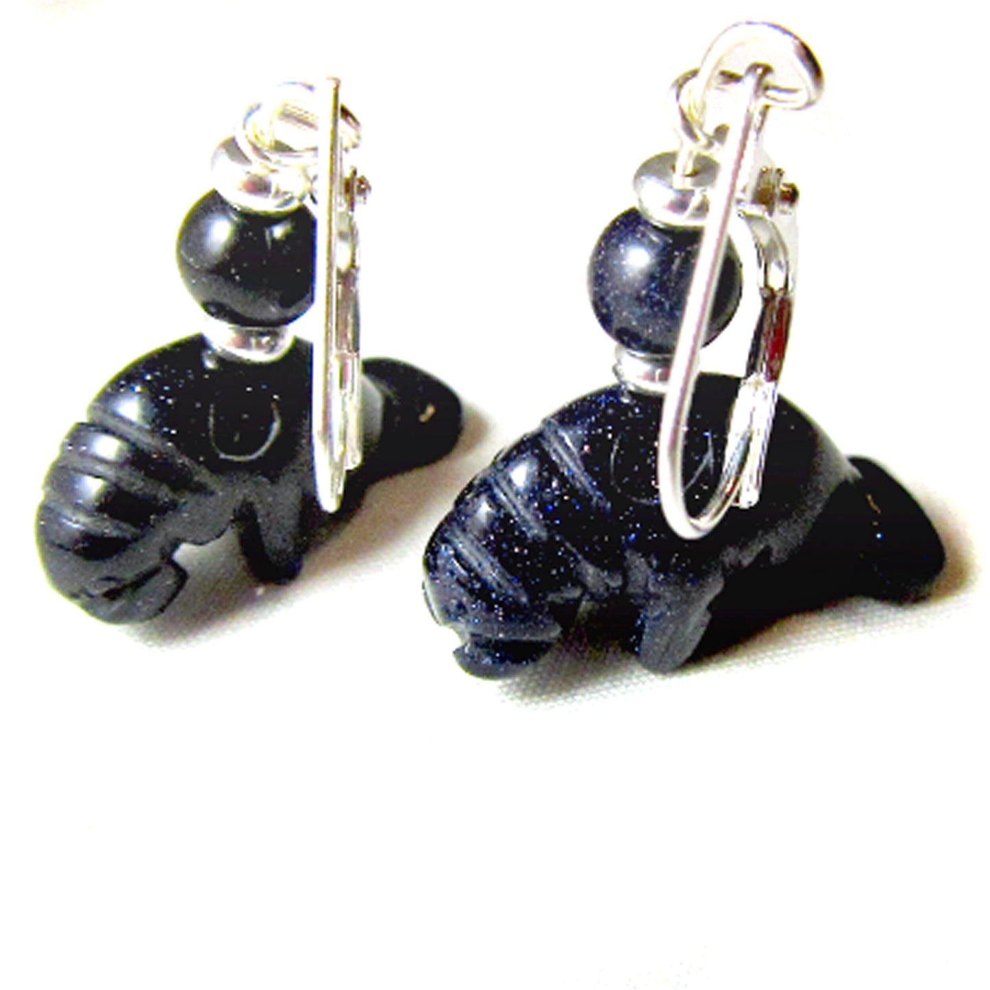 Stylish presentation of Manatee Earrings made of blue and orange goldstone, ideal accessories for animal lovers and nature enthusiasts.