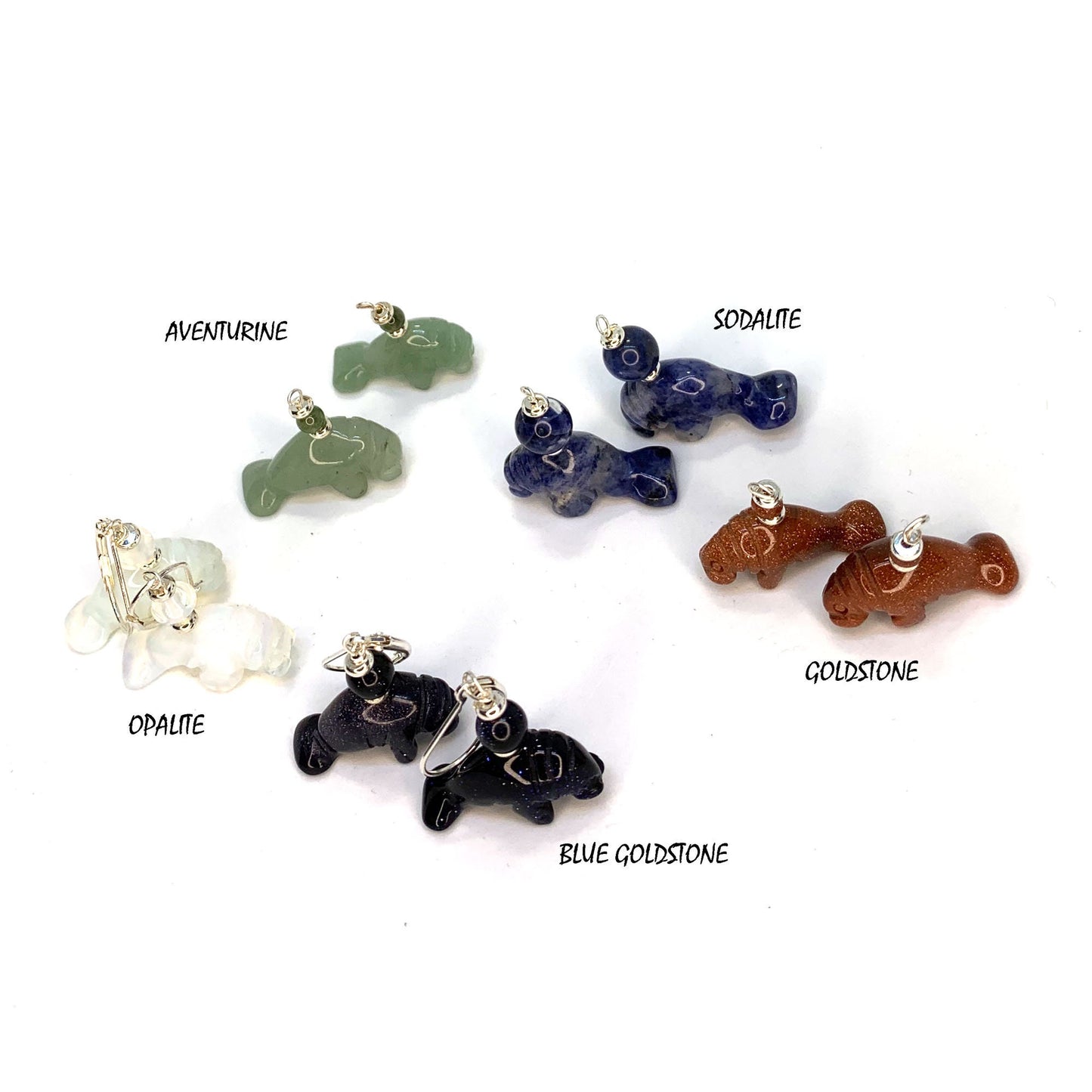 Aventurine Carved Stone Manatee Earrings hanging elegantly on display, symbolizing prosperity and purpose, great gift for those who love animals.