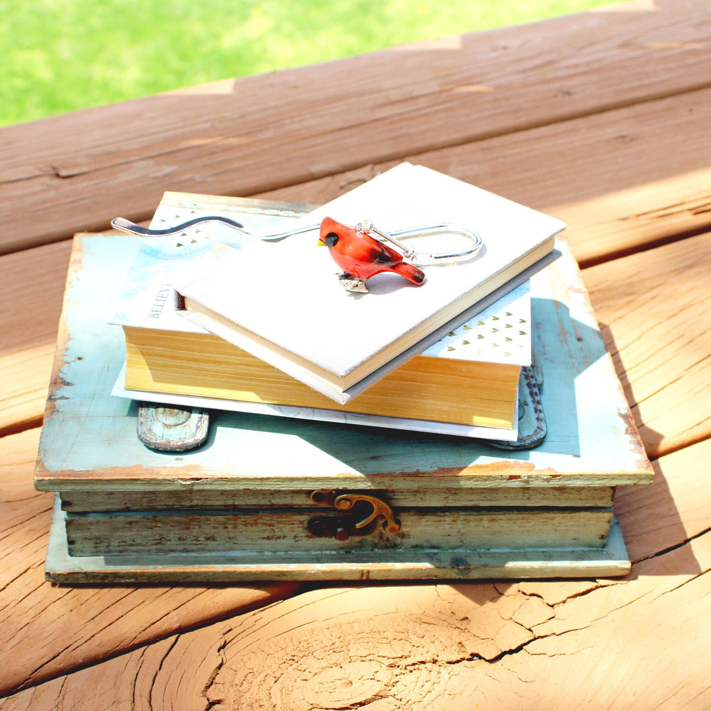 Red Bird Cardinal Bookmark - Songbird Metal Bookmarker against a natural backdrop, symbolizing messages from departed loved ones.