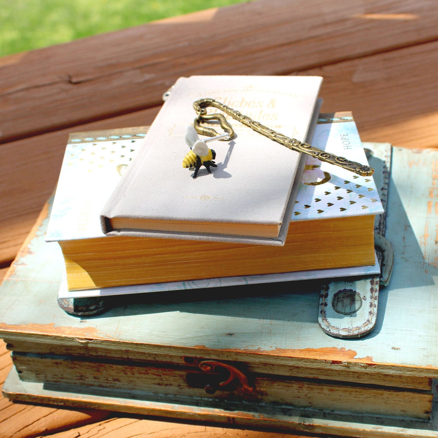 Close-up of the Buzzing Bee Porcelain Bookmark showcasing the detailed bronze and silver honeybee, ideal gift for nature enthusiasts.