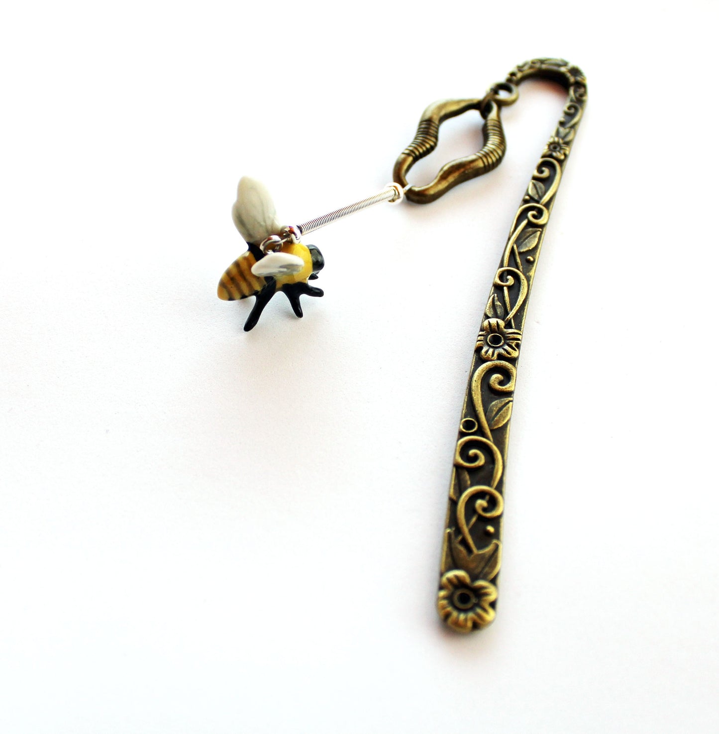 Buzzing Bee Porcelain Bookmark featuring a bronze floral base, perfect gift for bee lovers and apiculturists, stylish place marker for books.