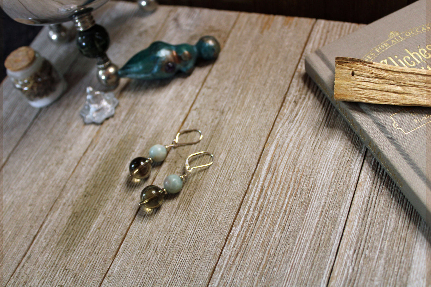 Sacred Geometry Larimar and Smokey Quartz Earrings displayed elegantly, showcasing the Zen Aesthetic Artisan-Designed Jewelry.
