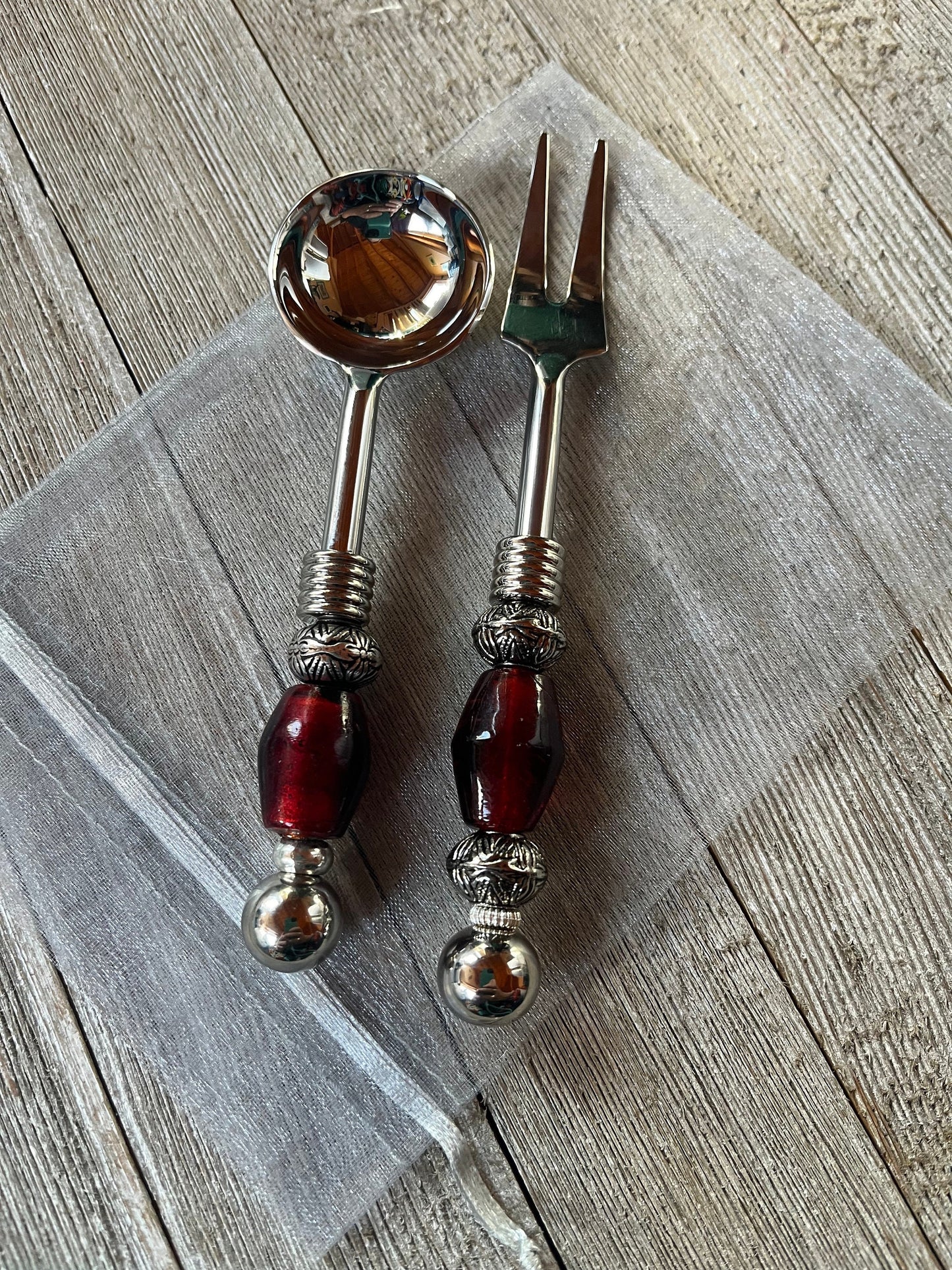 Complete party serving set featuring custom design stainless steel pieces, perfect for entertaining guests.