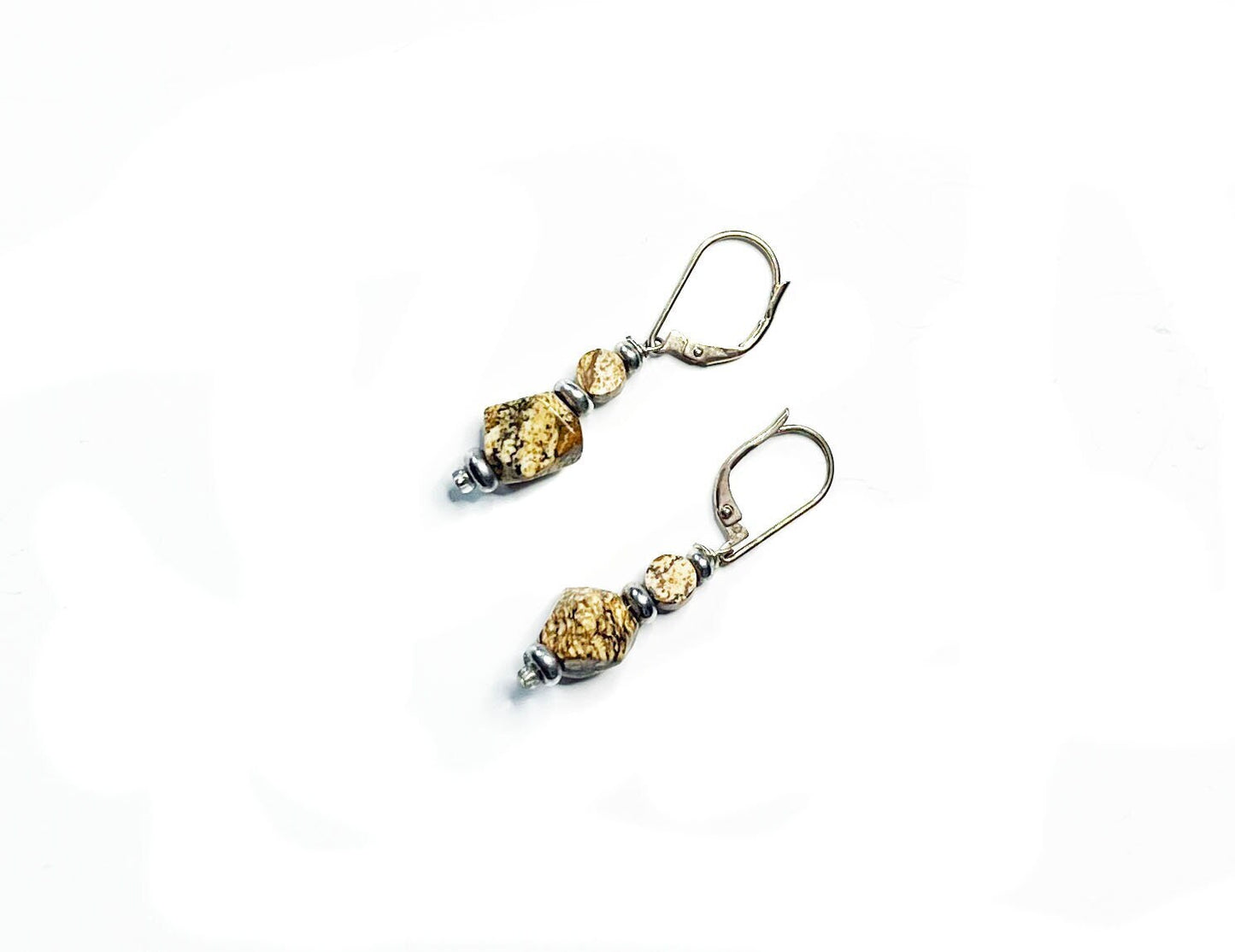The Handcrafted Jasper Earrings feature sterling silver lever-back clasps and textured gold and silver beads for a geometric Zen look, beautifully presented on a white background.