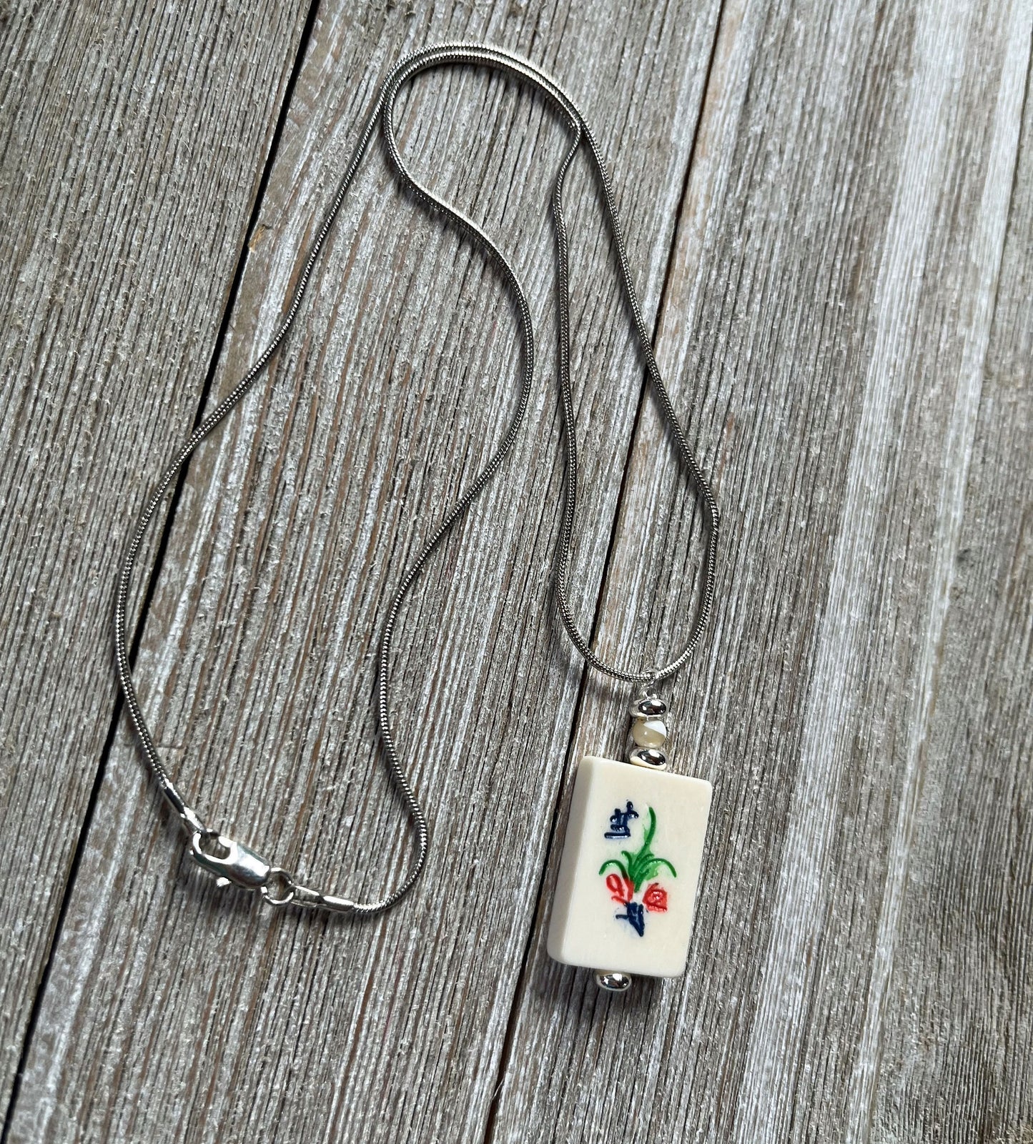 Set of Mahjong Tile Jewelry including earrings and necklace, flower bonus style for Mahjong enthusiasts.