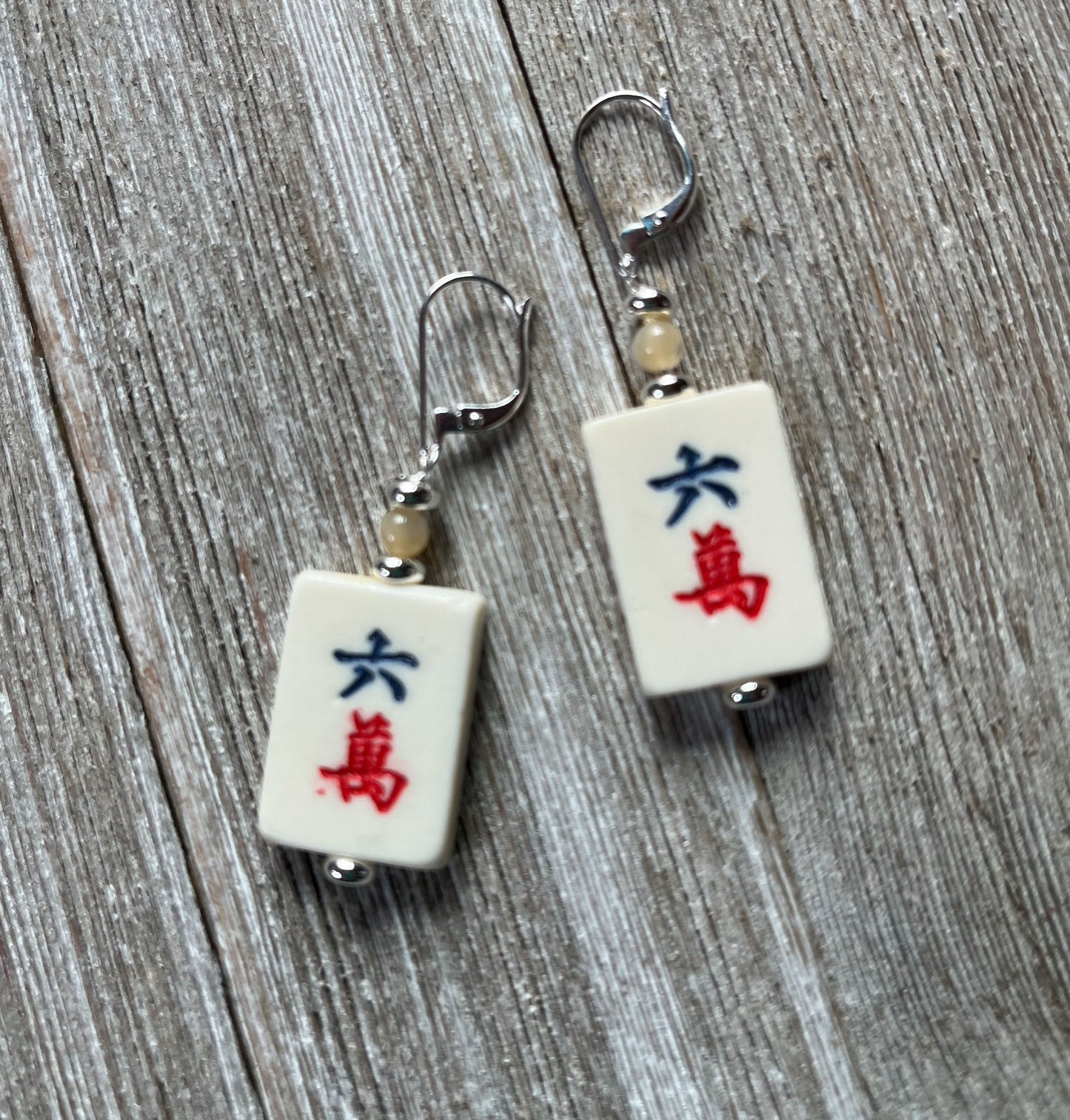 Mahjong Tile Earrings featuring vintage red dragon design, showcasing intricate floral patterns and characters.