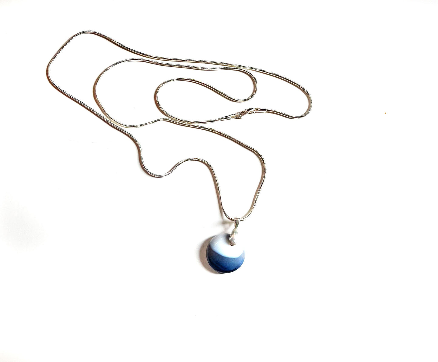Close-up of Blue Agate Pendant Minimalist Necklace - Simple Gift for a Friend, showcasing the handcrafted design and unique concentric circle pattern.