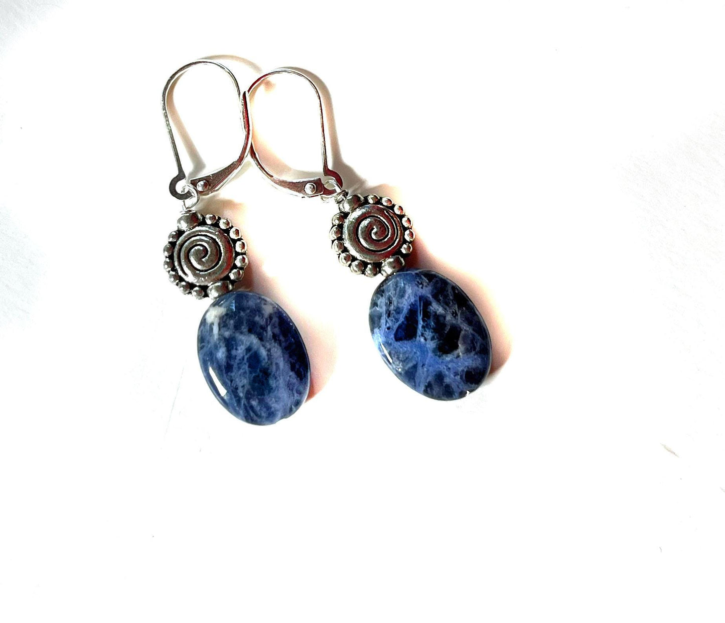 Close-up of Sodalite earrings - artisan-designed, showcasing intricate details and vibrant denim blue hues, ideal for enhancing intuition.