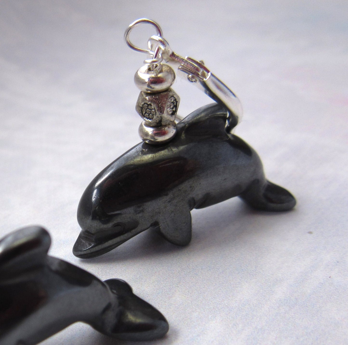 Dolphin Earrings Carved Black Hematite - Handmade earrings featuring cheerful dolphin design, ideal gift for zoologists and dolphin enthusiasts.