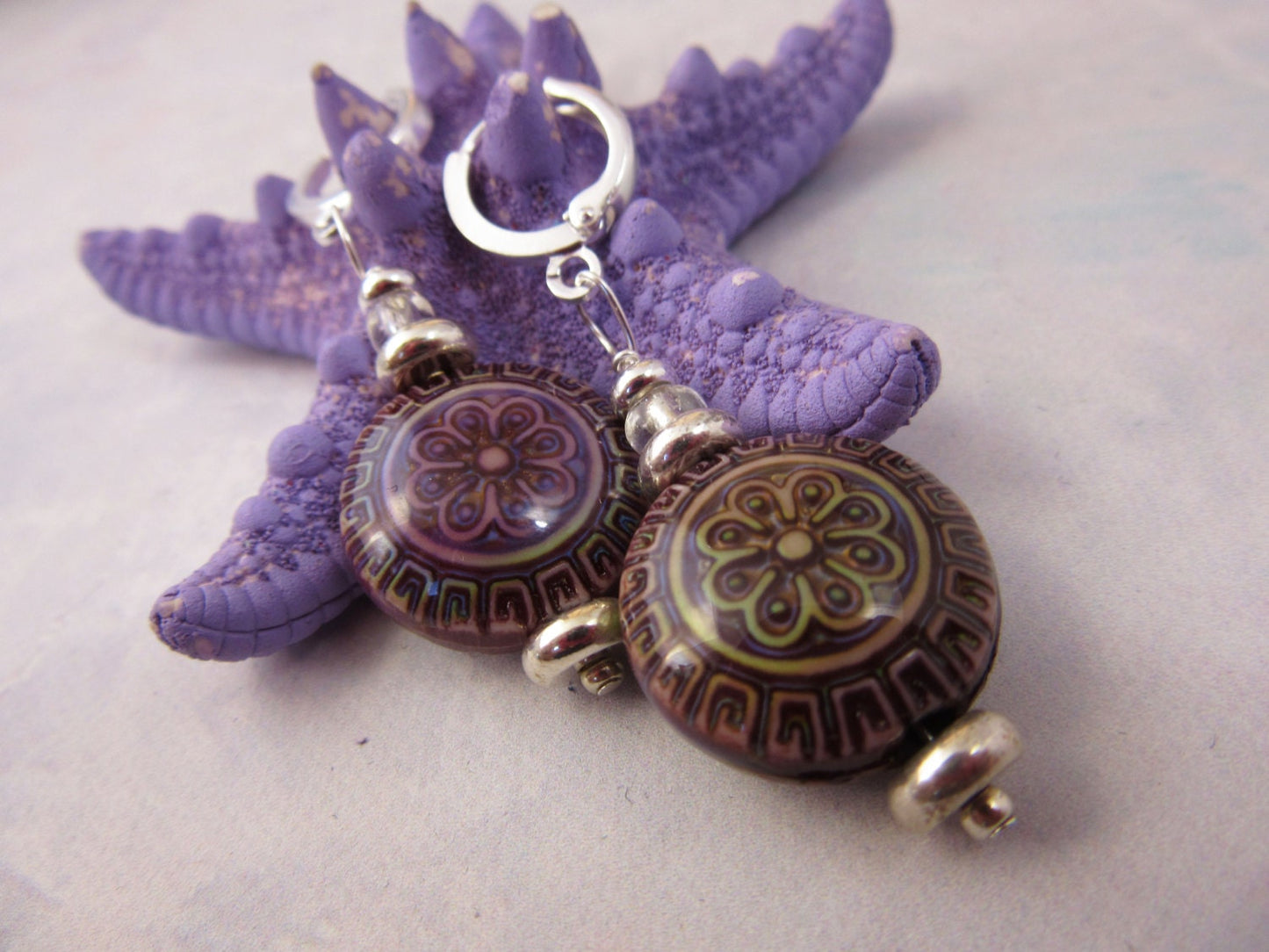 Magic Mood Change mandala earrings displayed elegantly, highlighting their boho flower theme and sterling silver lever backs.