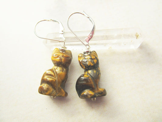 Handcrafted Tiger Eye Cat Earrings: Sterling Silver Lever Backs feature small, carved cat-shaped tiger’s eye stone pendants and secure lever-back hooks, shown against a light background.