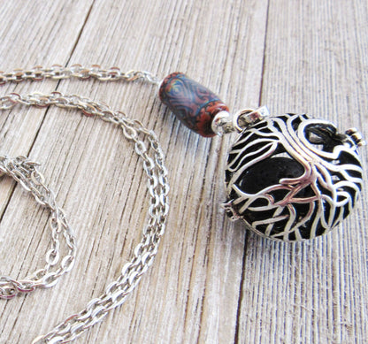 COLOR CHANGING essential oil jewelry, a beautiful aromatherapy essential oils diffuser necklace with Tree of Life design, ideal for enhancing relaxation and mood.