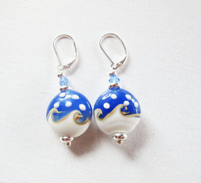 Ocean Wave Earrings say Hello - elegant gold earrings perfect for beach lovers, on sterling silver lever back, showcasing a unique ocean wave design.