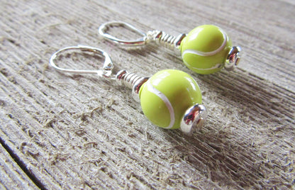 Close-up of Tennis Earrings featuring a fun tennis ball design, perfect for tennis players and fans, from Enlivenadorn by Gwynstone. Ideal gift for tennis enthusiasts.