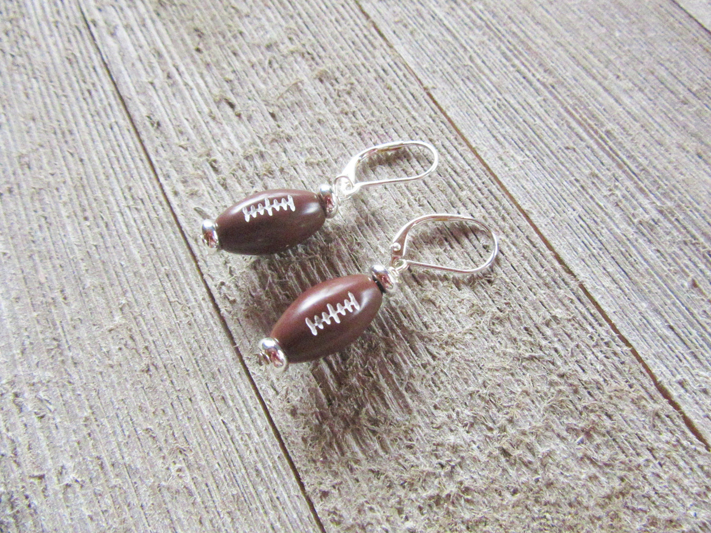 Football Novelty Earrings, Sports Team, Make a touchdown by giving this gift to the football fan you know. Light and fun for sports cheering