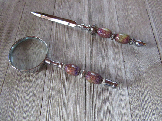 Close-up of the letter opener from the Desk Set Office Decor Gift featuring intricate silver design and multicolored mood beads.