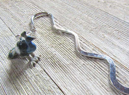Elegant Peacock Bookmark in use, enhancing a reading experience for book enthusiasts.