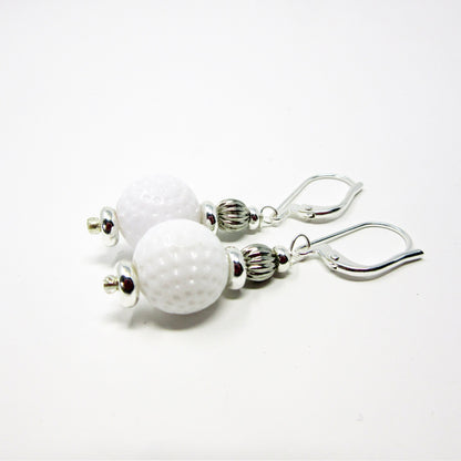 Golf Earrings a Gift for Woman Golfer set against a rustic backdrop, emphasizing the unique handmade quality.