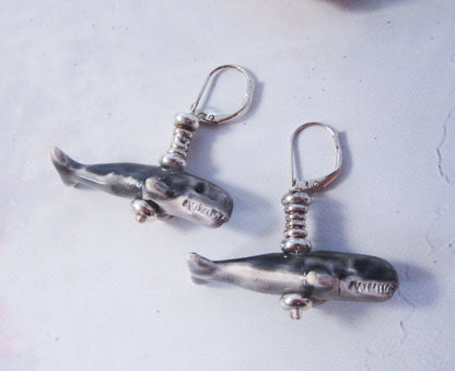 Close-up of hand-painted Sperm Whale Earrings, exotic animal gift perfect for sea animal science enthusiasts.
