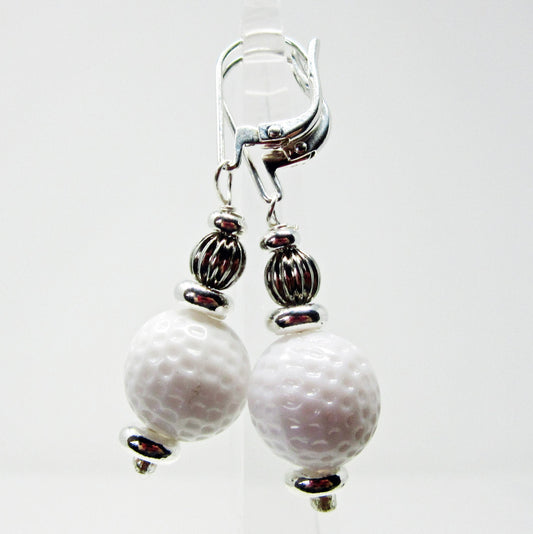Golf Ball Lever Back Earrings: Golfer Jewelry not to tee you off—white golf ball-textured beads with silver-toned spacers and ribbed accents on lever back hooks, ideal for any golf lover.