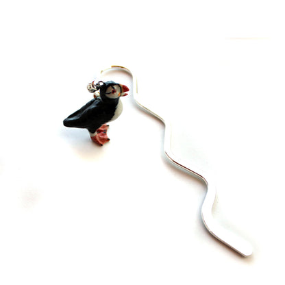 Puffin Bird metal bookmark placed in a cozy reading nook, perfect as a gift for avid readers, ocean lovers, and ornithologists.