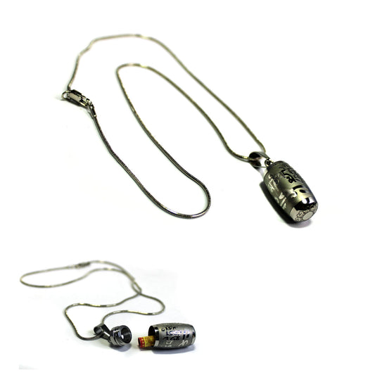The Silver Prayer Box Necklace features a cylindrical pendant with a secret chamber for small notes or essential oils. This Zen jewelry piece, engraved and set against a white background, is perfect as unique meditation jewelry.