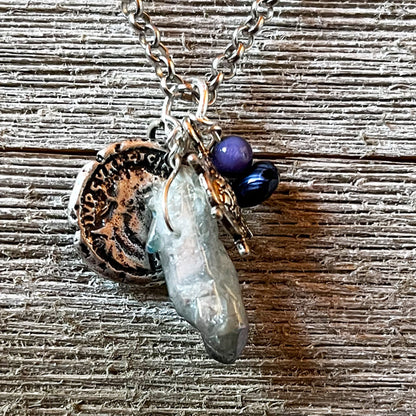 Pirate’s Booty Charm Necklace featuring gemstones, coin doubloons, crystals, and a ship's wheel from the BVI Blue Collection.
