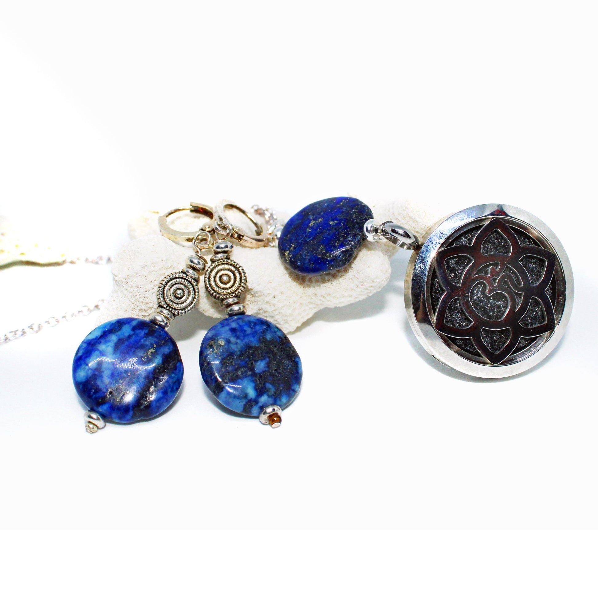 A Lapis Lazuli Jewelry Set featuring circular disc earrings with silver accents and a round lotus pendant, available separately or as a set, displayed on a light background.