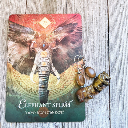 Elephant Earrings featuring carved stone elephants, a perfect gift for elephant lovers, with details in tiger's eye, dalmatine jasper, and opalite, designed by Enlivenadorn by Gwynstone.