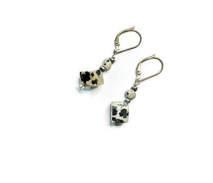 Sacred Geometry Dalmatian Jasper Cube Earrings showcasing the unique spotted Dalmatian Jasper in a cube design with sterling silver artisan craftsmanship.