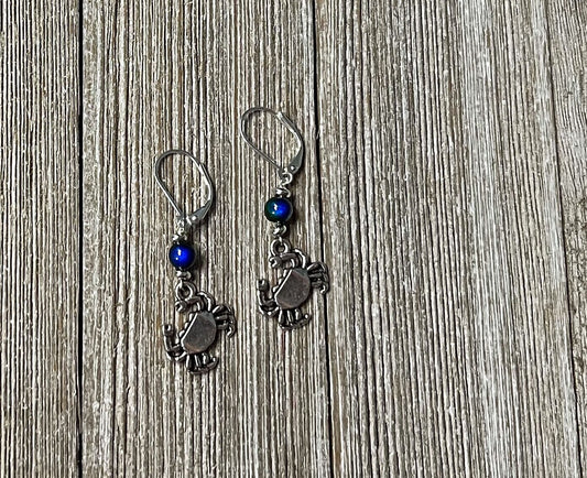 Crab Dangle Earrings – Color Changing Mood Bead, the perfect ocean lover gift, displayed on a rustic wooden surface.