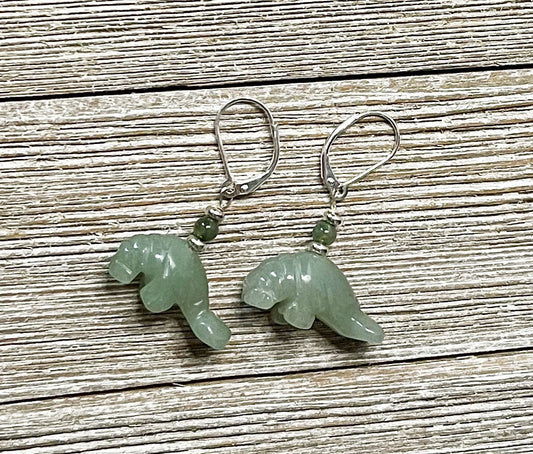 Green Aventurine Manatee Earrings: Handmade Sea Life Jewelry with green stone manatee charms and small green beads, displayed on light wood—ideal for sea life jewelry lovers.