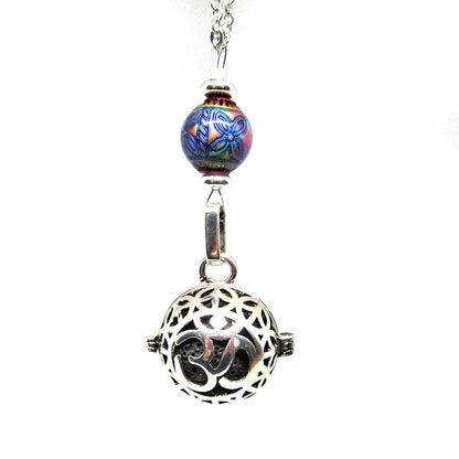 Close-up of the Namaste Symbol Color Changing Essential Oil Diffusing Zen Chamber Necklace, highlighting the essential oil chamber feature.