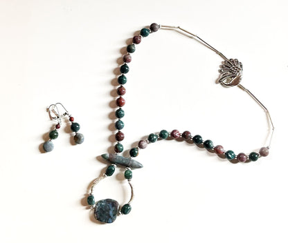 Close-up view of Fancy Peacock Jewelry Set highlighting the soft pastel Fancy Jasper stones and detailed sterling silver peacock clasp.