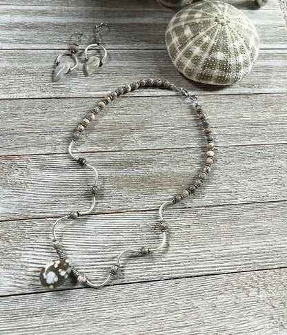 Model wearing Ocean Jasper Tear Drop and Wavy Sterling Silver Jewelry Set, showcasing its stylish design suitable for any occasion.