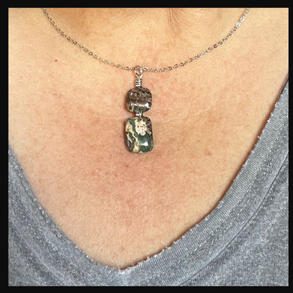 Close-up of the Rainforest Rhyolite Necklace from the Rainforest Rhyolite Jewelry Set, showcasing its intricate stone patterns and sterling silver chain.