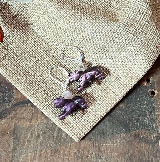 Panther Earrings: Bold purple earrings with big cat charms and Amethyst Cat's Eye stones, displayed on burlap over wood—perfect for adding Wild-Elegant Style to any look. Ideal gift for exotic animal and big cat lovers.
