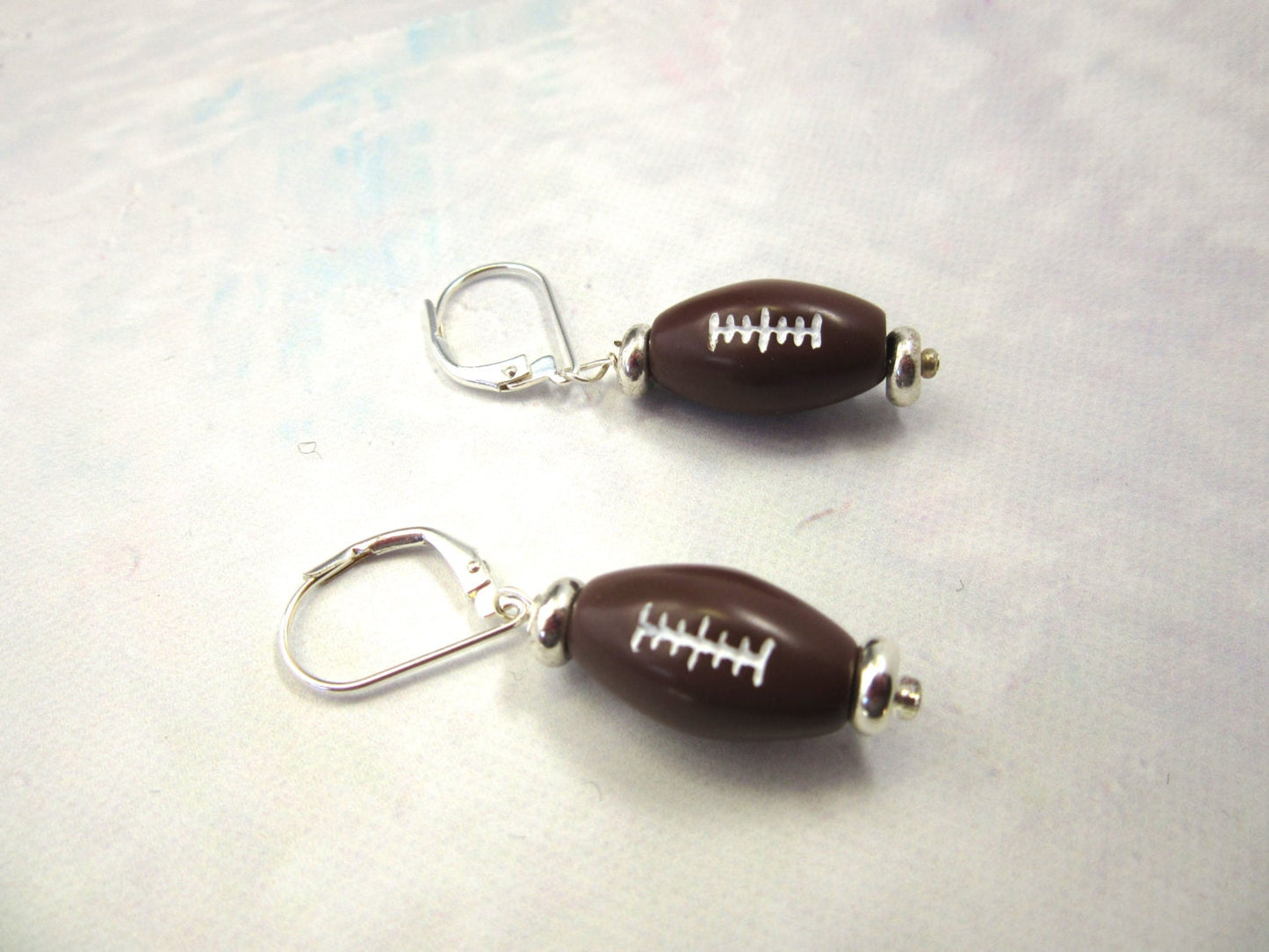 Football Novelty Earrings, Sports Team, Make a touchdown by giving this gift to the football fan you know. Light and fun for sports cheering