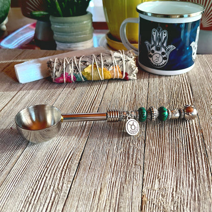Astro Bowl Spoon with zodiac-themed design and stone handle, ideal for scooping loose teas.
